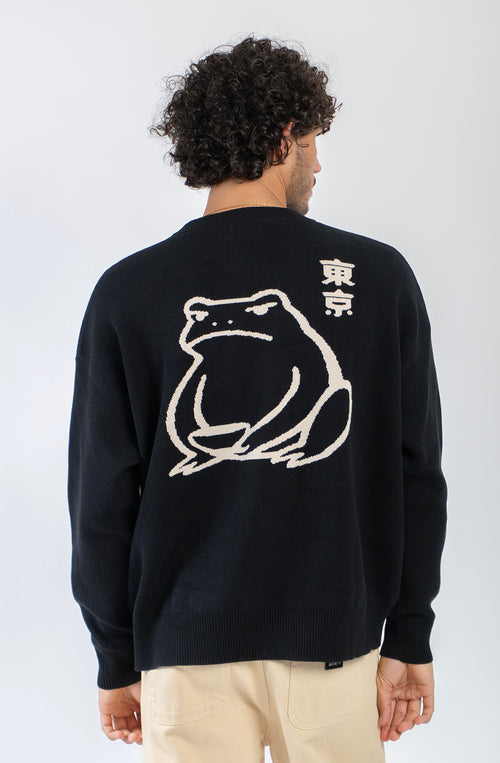 Jersey unisex de punto negro con detalle de caracteres japoneses en el pecho y gran jacquard de una rana con gráficos inspirados en Japón en la espalda.
