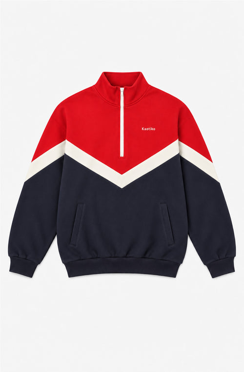 Sweat unisexe James bleu marine et rouge avec bande écrue en V, col montant zippé, poches latérales et logo Kaotiko sur la poitrine.