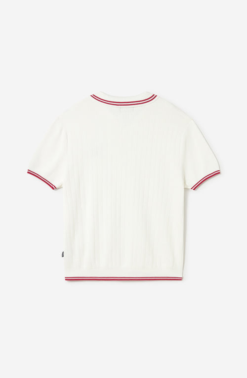 Polo Coffee Culture White de Kaotiko BCN en color blanco roto con textura acanalada, detalles en rojo en cuello y mangas y bordado “Coffee culture”.