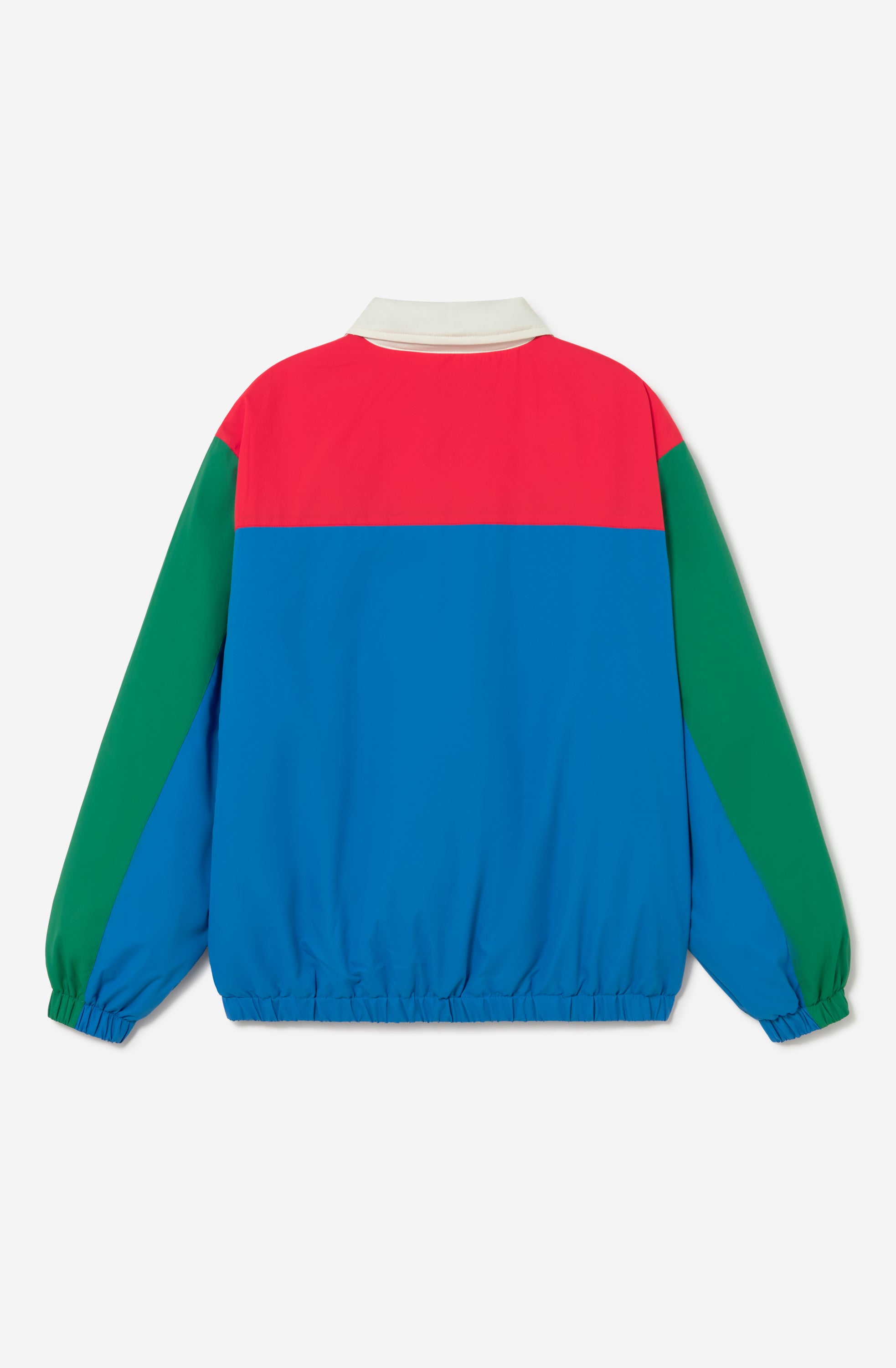 Chaqueta Kangaroo color block azul, verde, rojo y marfil con media cremallera y logo Kaotiko Society.