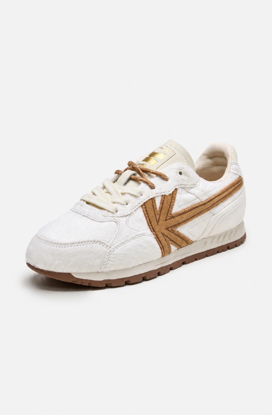 Zapatillas Seattle Pony White de pelo blanco con detalles marrones y suela de inspiración retro.