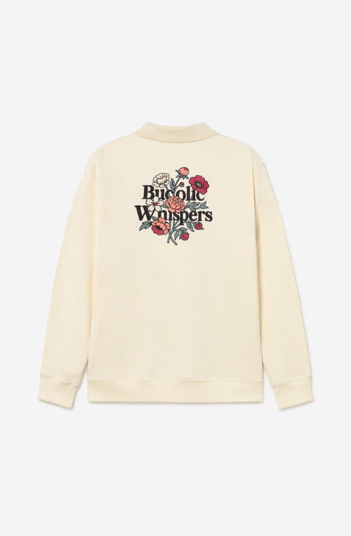 Sudadera zipper ivory con cuello polo, logo Bucolic Whispers en el pecho y bordado floral en la espalda.