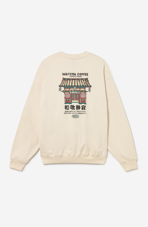 Sudadera oversize unisex de algodón orgánico en color crudo con pequeño gráfico japonés en el pecho e ilustración Matcha Temple en la espalda.